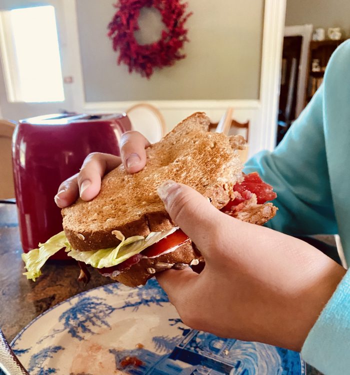 Lunch BLT hand held with bites missing