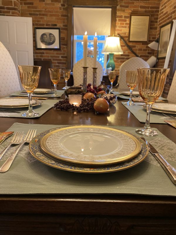 fall tablescape place setting with candle light