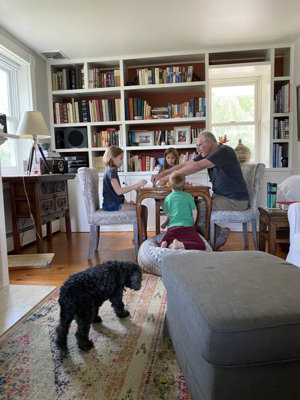 playing games with Grandpa on game table in the living room