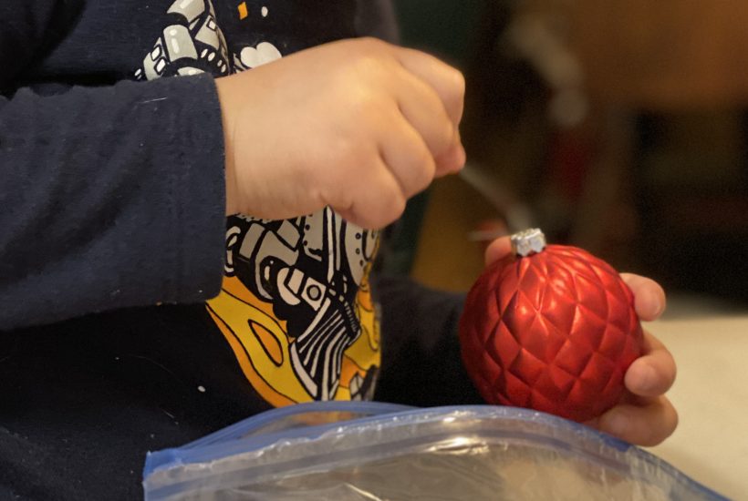 Little Hands with Red Ornament