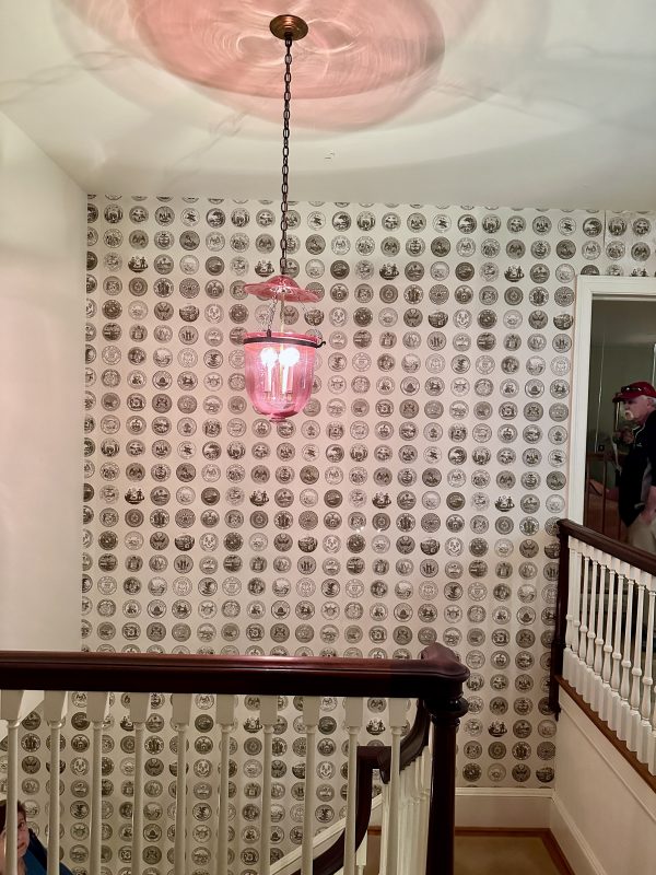 "The United States' Wallpaper Up the Stairs in Entry with each state Seal minus Hawaii. It was not a state yet.