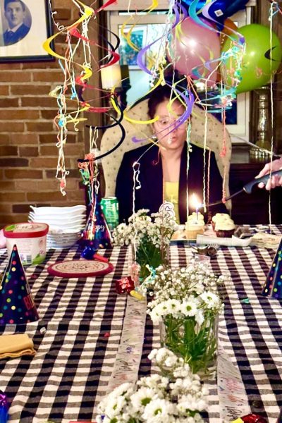 Tablescape with Meg blowing out candle